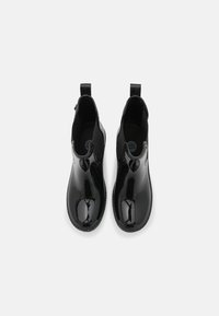 Black patent leather ankle boots with elastic side panels, round toe, and pull tabs at the back. Smooth, glossy finish with a lightweight sole.