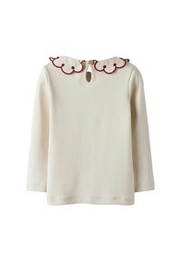 Camisa de manga larga color crema con cuello en forma de ondas y bordado rojo, además de un cierre en la espalda en forma de ojal con un botón de madera. Material de algodón suave.