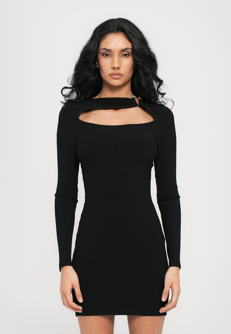 Black ribbed long-sleeve dress with a cutout neckline and a fitted silhouette. Features a discreet hardware accent at the neck.