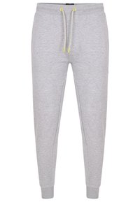 Graue Jogginghose mit einem Kordelzugbund, der kontrastierende gelbe Spitzen aufweist, schmal zulaufende Beine und gerippte Bündchen. Hergestellt aus weichem, strukturiertem Stoff.