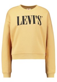 Felpa gialla in cotone con scollo a girocollo, spalle scese e logo nero "LEVI'S" stampato sul davanti. Taglio classico.