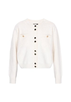 Vaaleankreeminen lyhyt villatakki, joka on valmistettu pehmeästä kankaasta. Siinä on pyöreä pääntie, ribattuja helmoja, nappikiinnitys sekä kaksi rintataskua kultanapeilla.