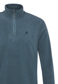 Pullover in pile di colore blu scuro con colletto alto, chiusura a zip quarti e piccolo logo sul lato sinistro del petto. Texture morbida in tutto il capo.