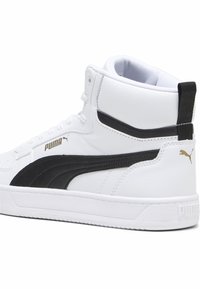 Valge nahk, mustade aktsentidega kõrge ülaosaga sneakers. Omab pehmendusega krae, valget vahevahet ja kuldset brändimist küljel. Tekstuuriga pind.