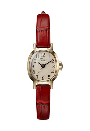 Small gold-tone Timex watch with beige dial, black numerals, black hour and minute hands, and a red leather strap.