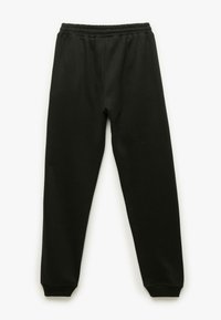 Zwarte sweatpants met een elastische tailleband, taps toelopende boorden, een zachte stofstructuur en geen zichtbare patronen of hardware-details.