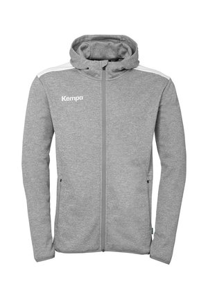 Grijze zip-up hoodie van zachte stof, voorzien van een capuchon, witte schouderaccenten en een logo "Kempa" op de linkerborst. Inclusief voorzakken.