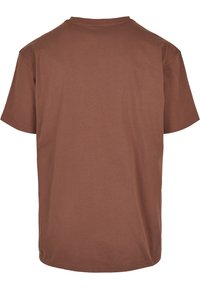 Brun bomull T-skjorte med rund hals, korte ermer og ensfarget design. Myk tekstur og avslappet passform uten synlige logoer eller mønstre.
