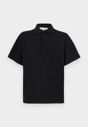 Black polo shirt with short sleeves, made of soft cotton. Features a collared neckline and four-button placket. Simple, minimalist design.