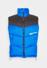 Blå och svart ärmlös pufferväst med framdragkedja och "KARL LAGERFELD JEANS"-logotyp på bröstet.