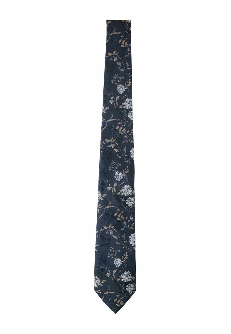 Cravate florale marine avec des fleurs et des feuilles blanches et beige sur un tissu texturé. Design slim avec une pointe effilée et une finition lisse.