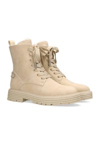 Beiga mockalädersstövlar med snörning framtill, rund tå och texturerad sula. Utrustade med ett mjukt inre foder och en ögla för att dra i bak. 