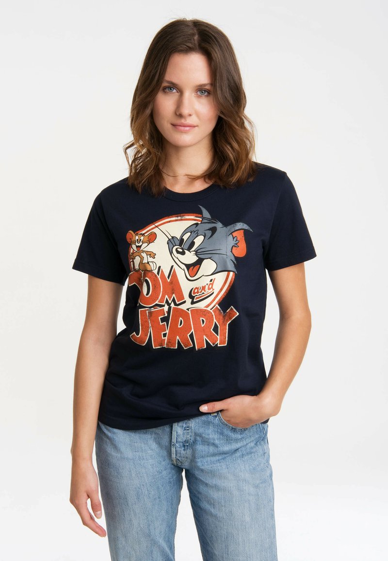 Navy blue cotton t-shirt featuring a graphic print of Tom and Jerry, with bold red text. Crew neck and short sleeves, casual fit.