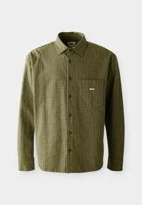 Groene en zwarte geblokte overshirt met lange mouwen, voorzak en geborduurd logo. Gemaakt van gestructureerde stof met een standaardkraag.
