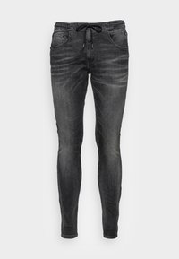 Černé džínové jogger kalhoty s elastickým pasem a šňůrkou, s předními kapsami a bledým povrchem pro opotřebovaný vzhled.