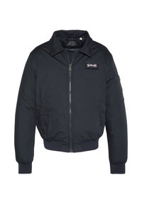 Bomber blu navy realizzato in tessuto resistente, dotato di cerniera frontale, colletto e polsini a costine, con una toppa logo sul petto.