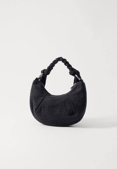 Holzweiler COCOON MICRO BAG UNISEX - Τσάντα χειρός - black washed