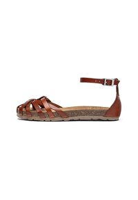 Sandal in pelle marrone con cinghie incrociate, cinturino alla caviglia e plantare in sughero. Suola bassa con superficie texturizzata per una presa migliore.
