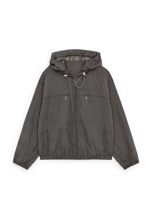 Dark gray lightweight hooded jacket with front zipper, elastic cuffs and hem, and two zippered chest pockets with drawstrings on hood.