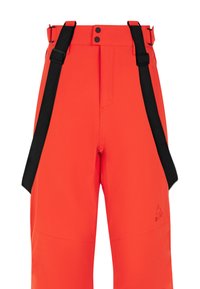 Pantalons de ski orange vif avec bretelles réglables noires. Présente deux boutons noirs et un logo discret sur la jambe gauche. Matériau lisse.