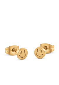 Orecchini a perno in tonalità oro a forma di facce sorridenti, con un design liscio e rotondo e dettagli incisi di sorriso e occhi.
