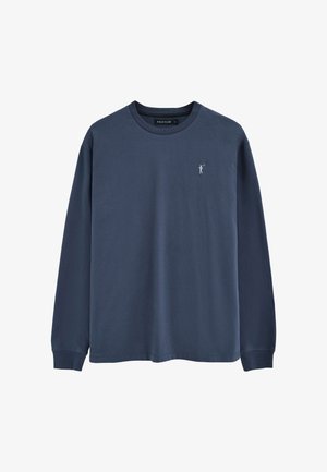 Maglietta blu navy a maniche lunghe con scollo a girocollo, piccolo logo Polo Club bianco sul petto a sinistra e polsini a costine.