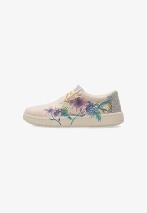 Beiger Sneaker mit niedrigem Schaft, gelben Schnürsenkeln und buntem Blumenmuster an der Seite, mit strukturierter grauer Ferse und beiger Sohle.