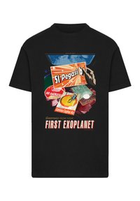 Black t-shirt featuring colorful graphic print with various exoplanet names and text reading "Greetings from your FIRST EXOPLANET."
