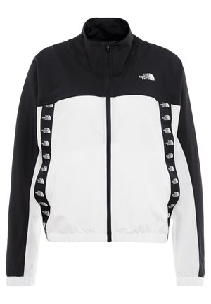 Czarno-biała kurtka zapinana na zamek, z długimi rękawami, wysokim kołnierzem oraz logo The North Face na klatce piersiowej i pionowych bocznych pasach.