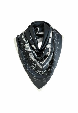 Schwarzer Seidenschal mit weißen Blumen-, Stern- und gepunkteten Mustern, zu einer dreieckigen Form auf einem weißen Hintergrund gefaltet.