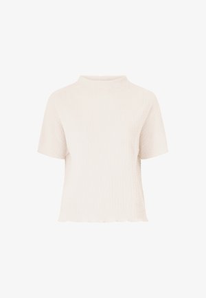 Korte mouwen, hoge hals top van een textuur crème stof met een gegolfde zoom. Beschikt over een subtiele gekreukte patroon voor extra detail.