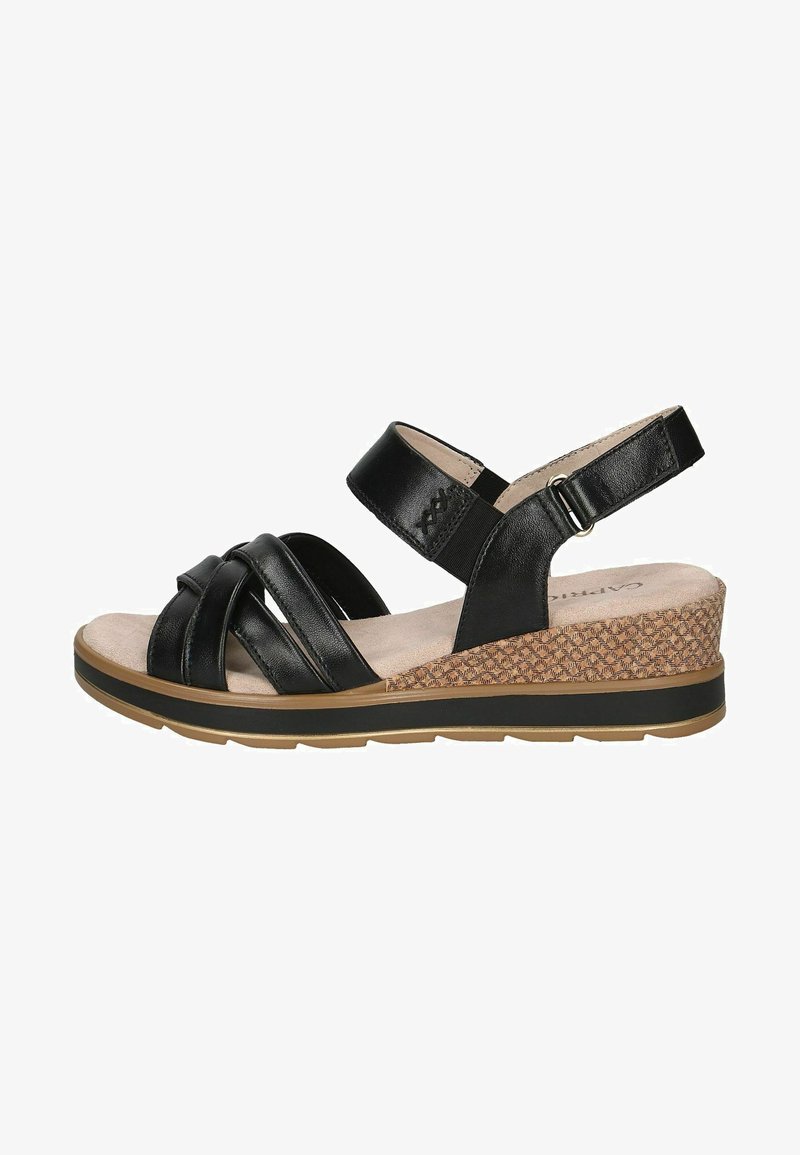 Czarna skórzana sandał z krzyżującymi się paskami, regulowanym paskiem wokół kostki, teksturowanym obcasem na koturnie oraz wyściółką amortyzującą na żłobionej gumowej podeszwie.