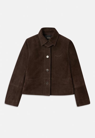 Brown suede cropped jacket with a fold-down collar, front button closure, and embroidered logo detail. Features long sleeves and two front pockets.