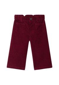 Pantalon en velours côtelé bordeaux à jambes larges, avec une taille plate, des poches avant et un détail de bouton en métal. Tissu texturé avec des côtes verticales.