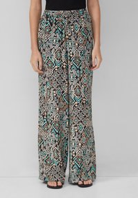 Pantaloni a gamba larga con un motivo geometrico in colori nero, turchese, beige e bianco. Vita elastica e tessuto fluido.