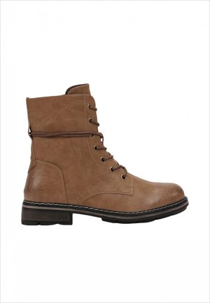 Bottine en cuir tan avec lacets sur le devant, bout arrondi et semelle en caoutchouc noire. Avec des détails de couture et un léger talon.