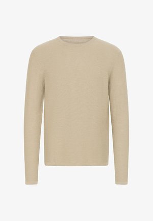 Béžový svetr s dlouhým rukávem a kulatým výstřihem, vyrobený z měkké pleteniny. Jednoduchý design bez viditelných vzorů či ozdob.
