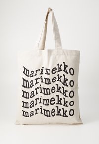 Beiger Canvas-Shopper mit wiederholt schwarzem Text "marimekko" in unterschiedlichen Winkeln. Verfügt über robuste Griffe und ein einfaches Design.