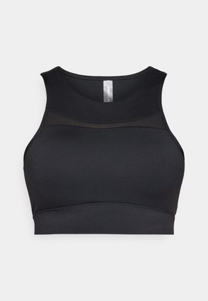 Reggiseno sportivo nero con scollo rotondo e spalline larghe. Realizzato in materiale liscio ed elastico con un pannello trasparente sul petto.