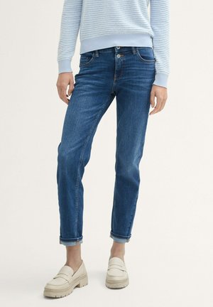 - Jeansy Slim Fit
