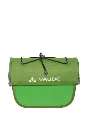 Green Vaude brand roll-top bag with black drawstring closure and diamond pattern on the lower part.