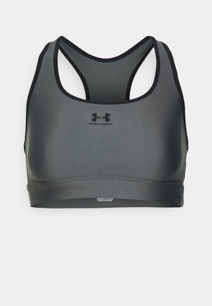 Under Armour sports bra in dark gray with a sleek design, racerback style, textured fabric, and minimal black logo.