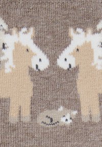 Knit socks featuring two cartoon-style horses in beige and white against a brown background, with a small white detail at the bottom.