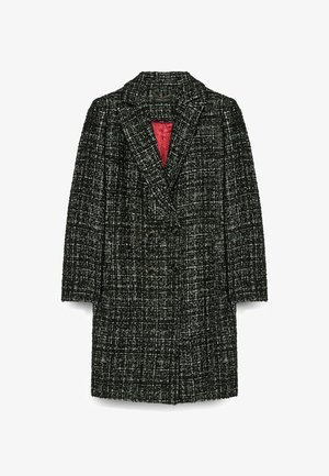 Doppelreiher-Mantel aus schwarz-weißen Tweed mit strukturiertem Muster, ausgestattet mit einem roten Innenfutter und Reverskragen.