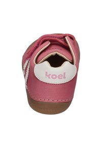 Pink children's shoe with a leather upper, white accents, and a textured rubber sole. Features a closed back and "koel" branding.