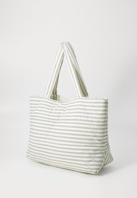 Quilted tote bag made of lightweight fabric, featuring vertical stripes in white, green, and blue. Two elongated handles for carrying.