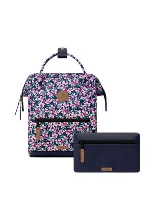Floral-patterned backpack with pink flowers and front zipper pocket, paired with a solid navy blue wallet with zipper and leather zipper pull.