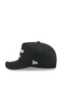 Black cap with a curved visor and embroidered white text on the front. Features a small logo on the side and a fitted design.