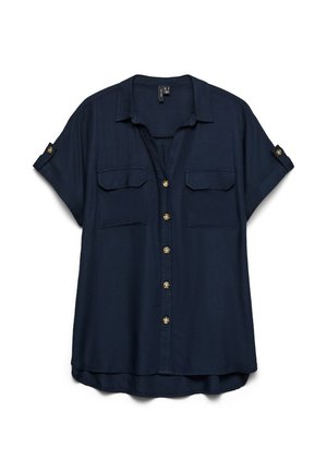 Μπλε ναυτικό κοντομάνικο μπλούζα με εμπρόσθιο κούμπωμα με κουμπιά, δύο τσέπες στο στήθος με καπάκια και γυρισμένα μανίκια που στερεώνονται με λουράκια με κουμπιά.
