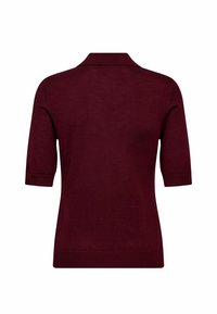 Burgundi rövid ujjú polo pulóver, mely finom kötött anyagból készült. Klasszikus gallérral és szoros fazonnal rendelkezik, egyenes aljjal.